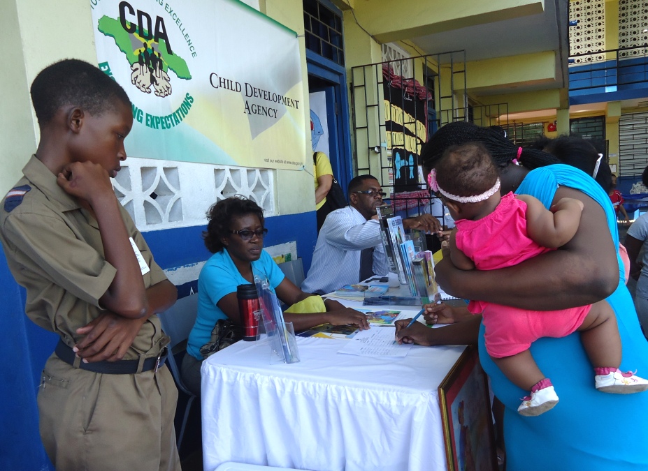 Parents Get Information from the CDA Booth at Allman Town Primary